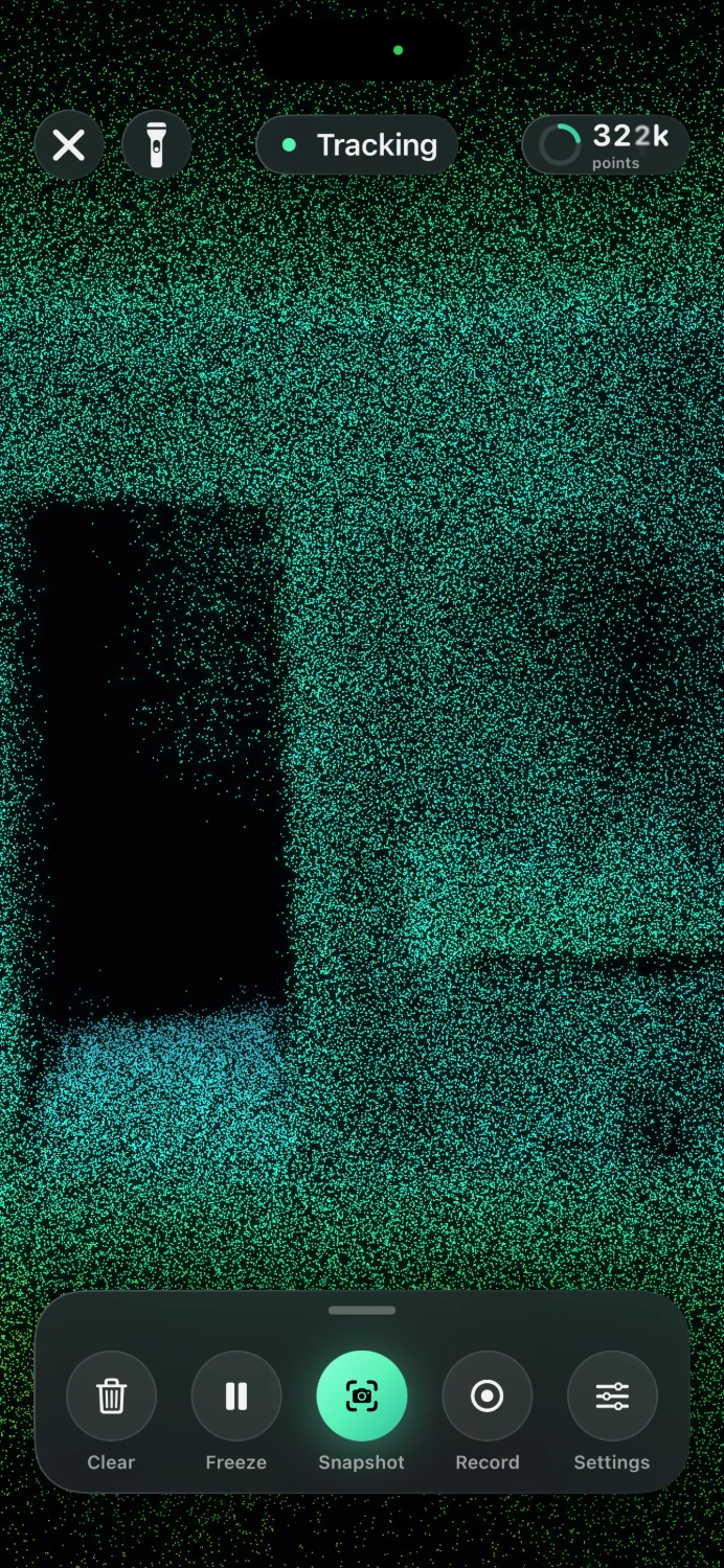 Dots view: a room drawn in hundreds of thousands of green and teal points, with a dark open doorway on the left